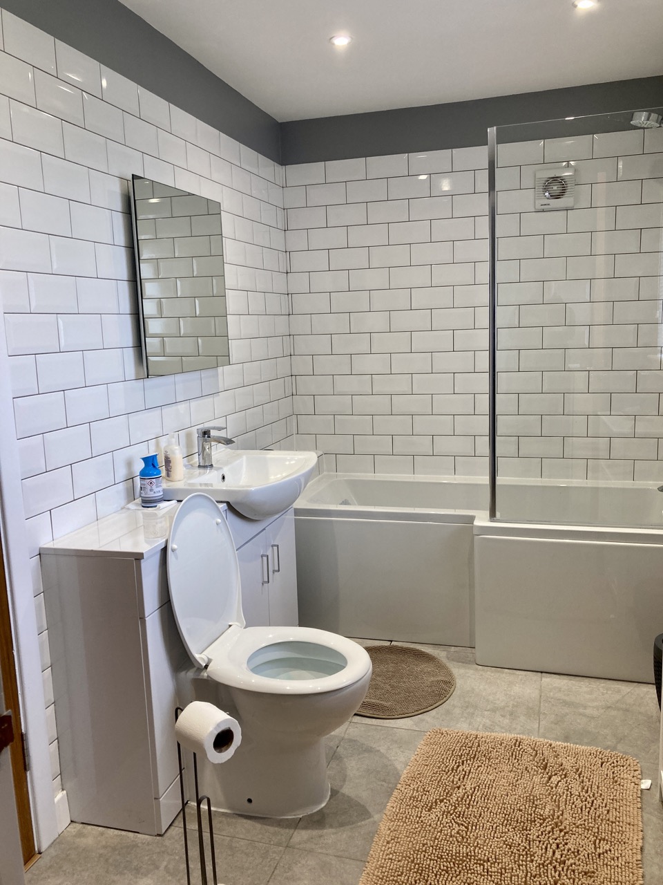 Bathroom with walk-in shower and warm timber finish