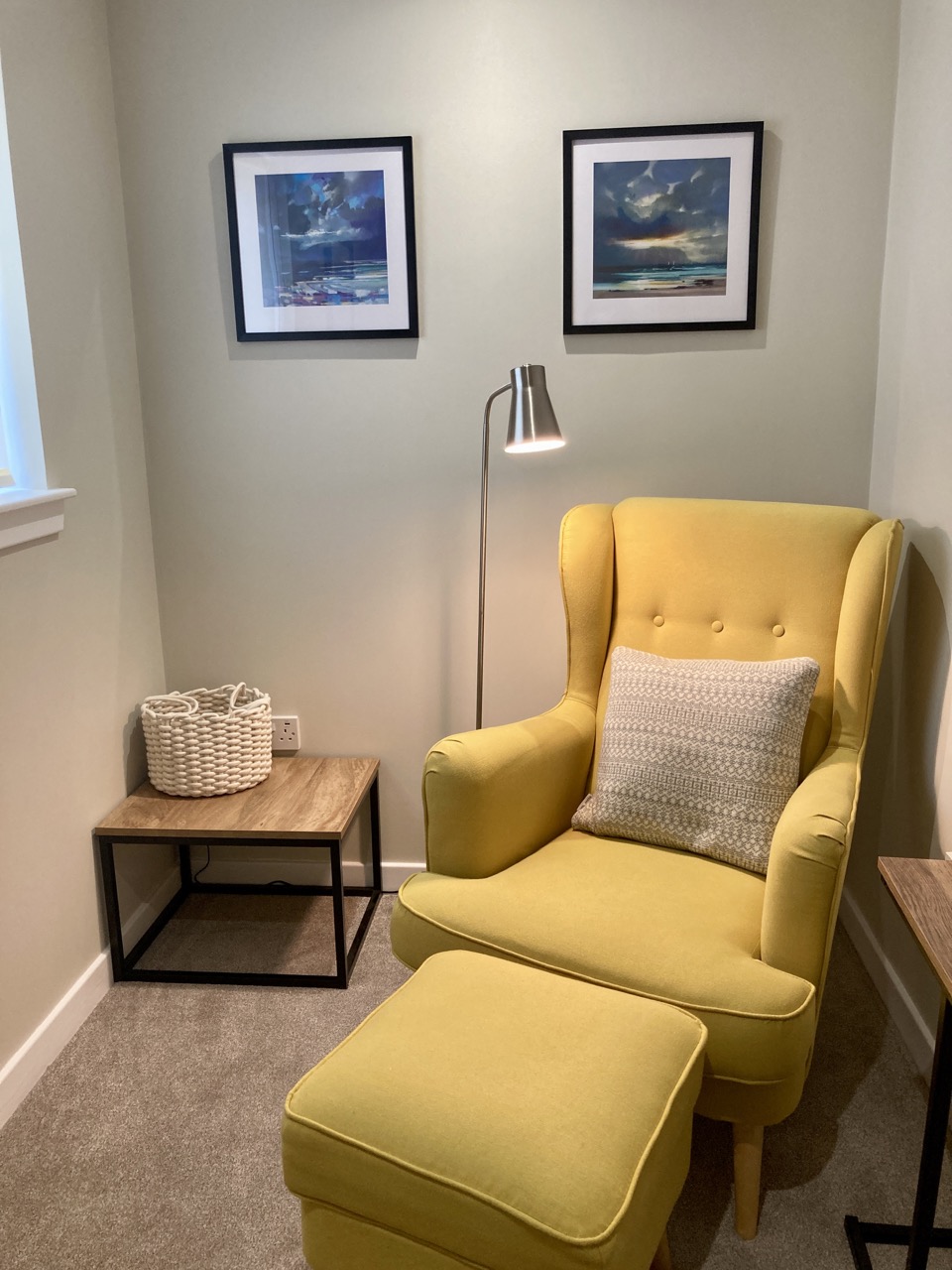 Cosy snug reading nook with sofa and window light